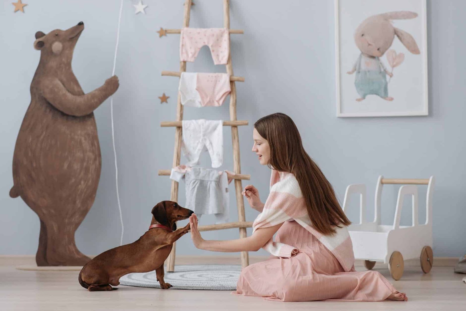 a pregnant woman training her dog